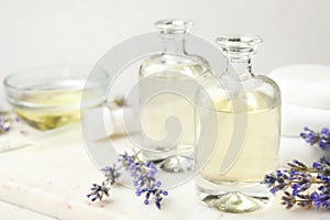 Bottles with natural lavender essential oil on , space for text