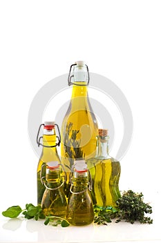 Bottles olive oil with herbs