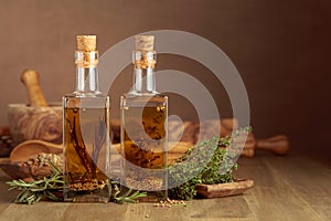 Bottles of olive oil with herbs and spices