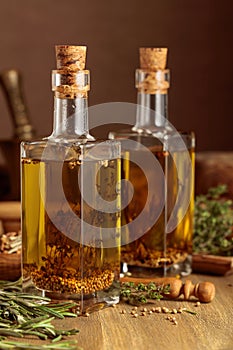 Bottles of olive oil with herbs and spices