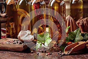 Bottles of olive oil with various spices