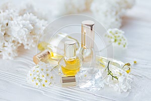 Bottles of perfume with flowers