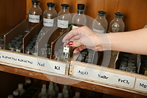 Bottles with Potassium iodide in the hand close up