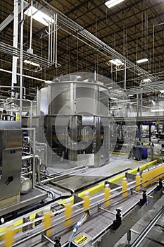 Bottles on production line at bottling plant