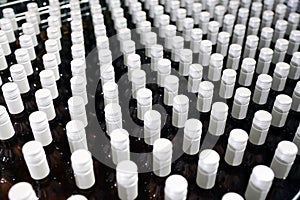 Bottles in a row at wine cellar. Stacked up wine bottles in the cellar