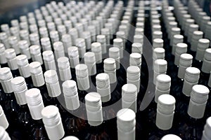 Bottles in a row at wine cellar. Stacked up wine bottles in the cellar