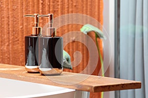 Bottles of shampoo and soap in a bathroom