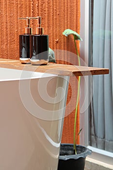 Bottles of shampoo and soap in a bathroom