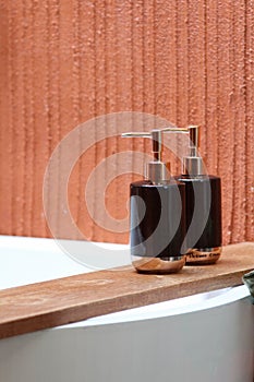 Bottles of shampoo and soap in a bathroom