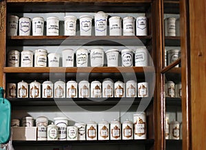 Bottles on the shelf of old pharmacy