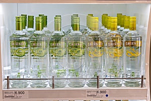Bottles of Smirnoff vodka on a shelf in duty free shop airport