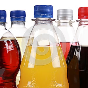 Bottles with soda drinks like cola and orange lemonade