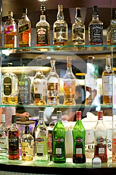 Bottles of spirits and liquor at the bar photo