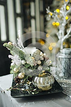 Bottles and tree toys in vintage Christmas decorated room