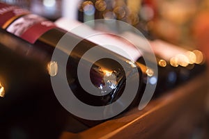 Bottles of wine in a row in a wine store close-up