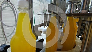 Bottling lemonade at the factory. Production of beverages - carbonated lemonade, in plastic bottles.