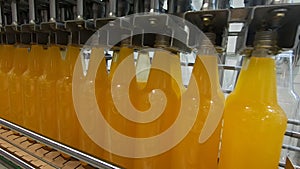 Bottling lemonade at the factory. Production of beverages - carbonated lemonade, in plastic bottles.