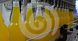 Bottling lemonade at the factory. Production of beverages - carbonated lemonade, in plastic bottles.