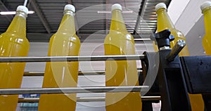 Bottling lemonade at the factory. Production of beverages - carbonated lemonade, in plastic bottles.