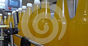 Bottling lemonade at the factory. Production of beverages - carbonated lemonade, in plastic bottles.