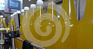 Bottling lemonade at the factory. Production of beverages - carbonated lemonade, in plastic bottles.