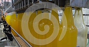 Bottling lemonade at the factory. Production of beverages - carbonated lemonade, in plastic bottles.