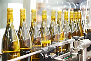 Bottling and seaaling conveyor line at winery factory