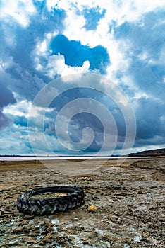 The bottom of the dried-up Kuyalnitsky estuary, covered with a layer of white self-precipitating table salt, clouds are reflected