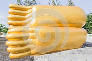 Bottom feet of reclining Buddha golden statue in Thailand