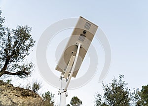 Bottom of a solar streetlight, with a view of the motion sensor and led bulbs