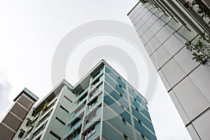 Bottom up view, on a cloudy day, of Public Housing Apartments in Singapore. Also know as HDB, these are government built vertical