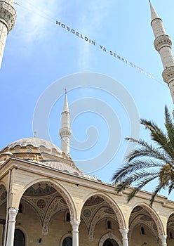 bottom-up view of the inscription of Hosgeldin ya sehri Ramazan between the minarets. Translation from turkish: Welcoming Ramadan