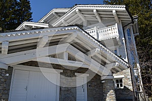 Bottom view of a beautiful modern house with white details, photographed outside