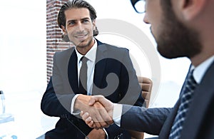 Bottom view. confident handshake of business partners