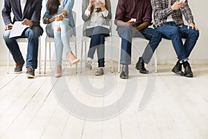 Bottom view of diverse work candidates waiting for job interview