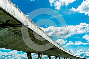 Bottom view of elevated concrete highway. Overpass concrete road. Road flyover structure. Modern motorway. Transportation