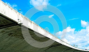 Bottom view of elevated concrete highway. Overpass concrete road. Road flyover structure. Modern motorway. Transportation