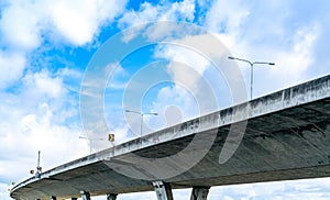 Bottom view of elevated concrete highway. Overpass concrete road. Road flyover structure. Modern motorway. Transportation