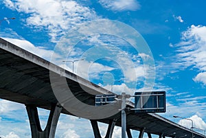 Bottom view of elevated concrete highway. Overpass concrete road. Road flyover structure. Modern motorway. Transportation