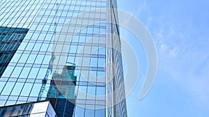 Bottom view of glass silhouette of skyscraper. Business building.