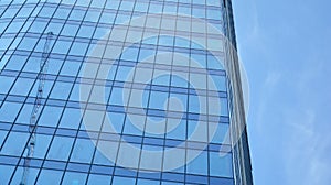 Bottom view of glass silhouette of skyscraper. Business building.