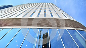 Bottom view of glass silhouette of skyscraper. Business building.