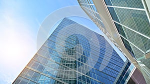 Bottom view of glass silhouette of skyscraper. Business building.