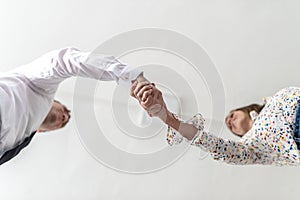 Bottom view of a handshake of a businessman and woman