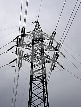 Bottom view of a high-voltage power line support. Industrial power engineering.