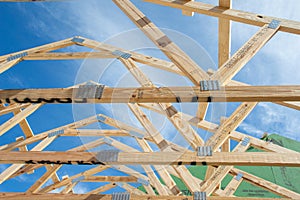 Bottom view, medium distance of, a group of, secured roof trusses