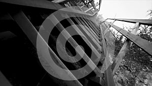 Bottom view of old stairs sky background black and white. Footage. Thai wooden house stair style. Old wooden bridge at