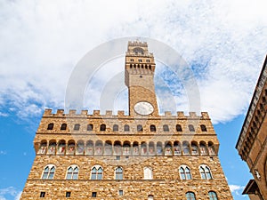 Bottom view of Pallazo Vecchio, Old Palace - Town Hall, with high bell tower, Piazza della Signoria, Florence, Tuscany