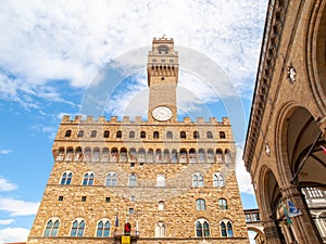 Bottom view of Pallazo Vecchio, Old Palace - Town Hall, with high bell tower, Piazza della Signoria, Florence, Tuscany