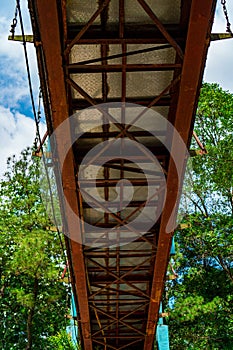 bottom view of the pedestrian bridge crossing the river.